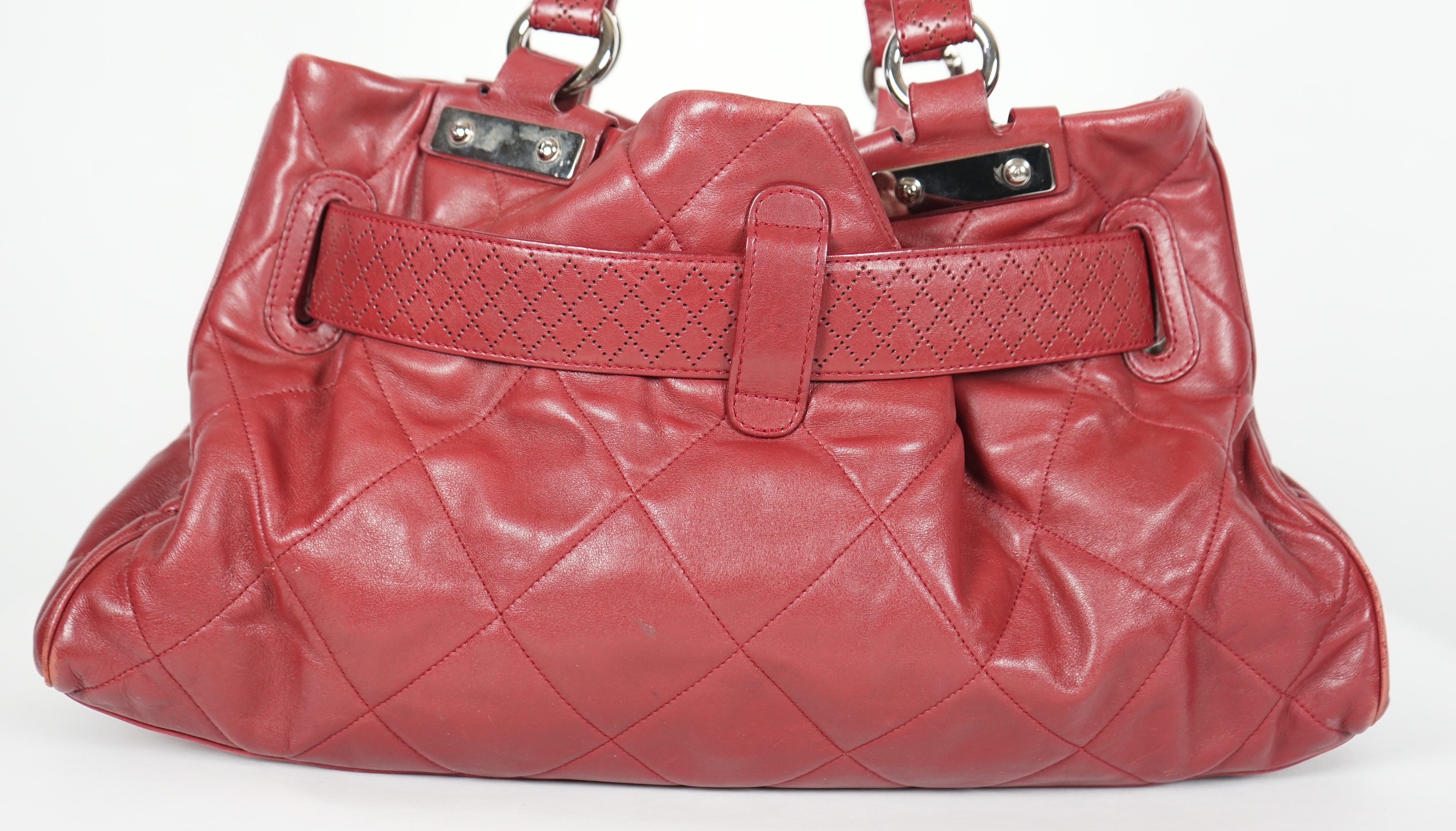 A Chanel burgundy leather buckled handle bag, with dust bag, width 45cm, height: 24.5cm, height overall 44cm, depth 16.5cm, Please note this lot attracts an additional import tax of 20% on the hammer price